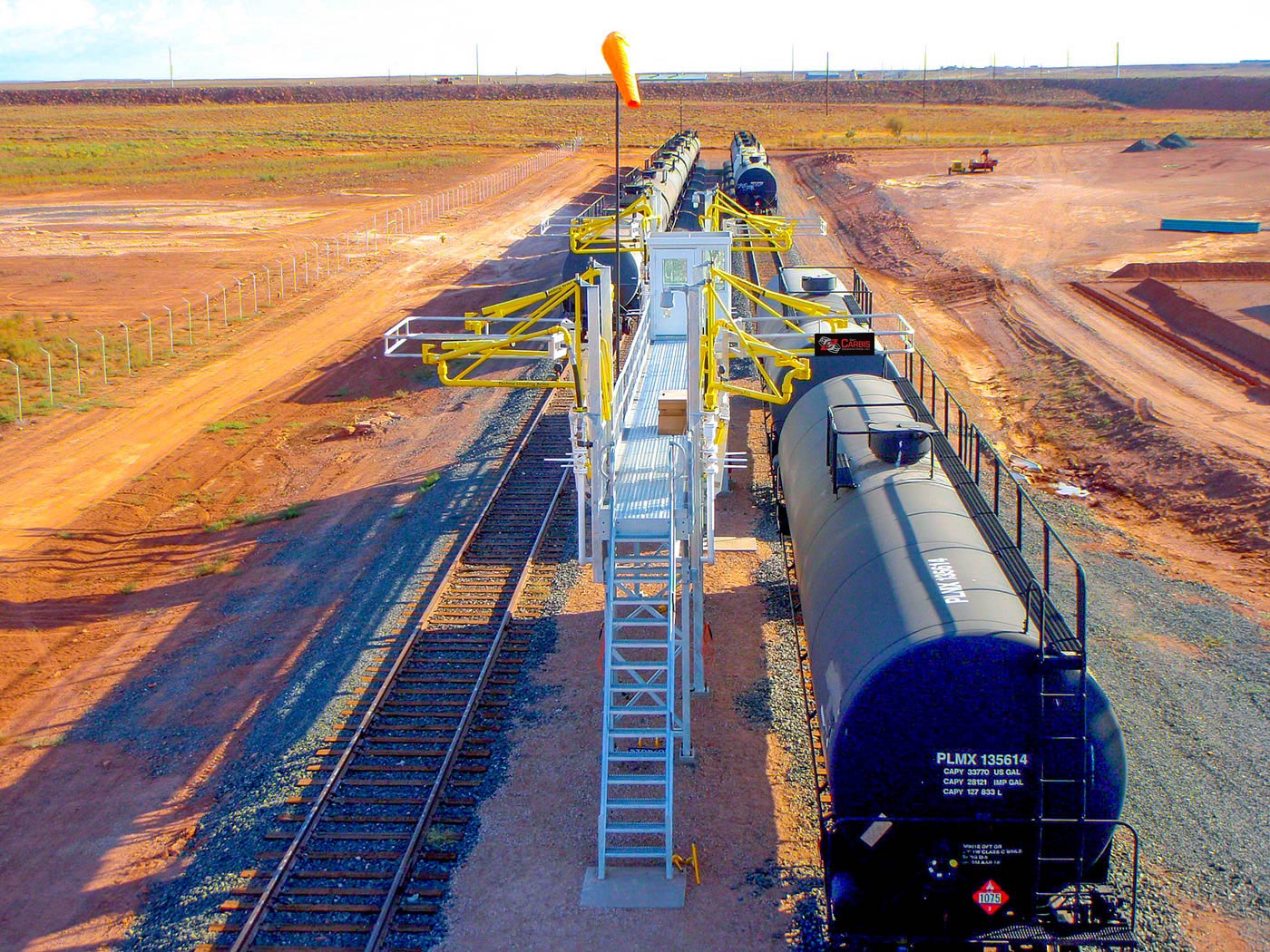 an overhead view of multi hatch bays at the end of a rail line.