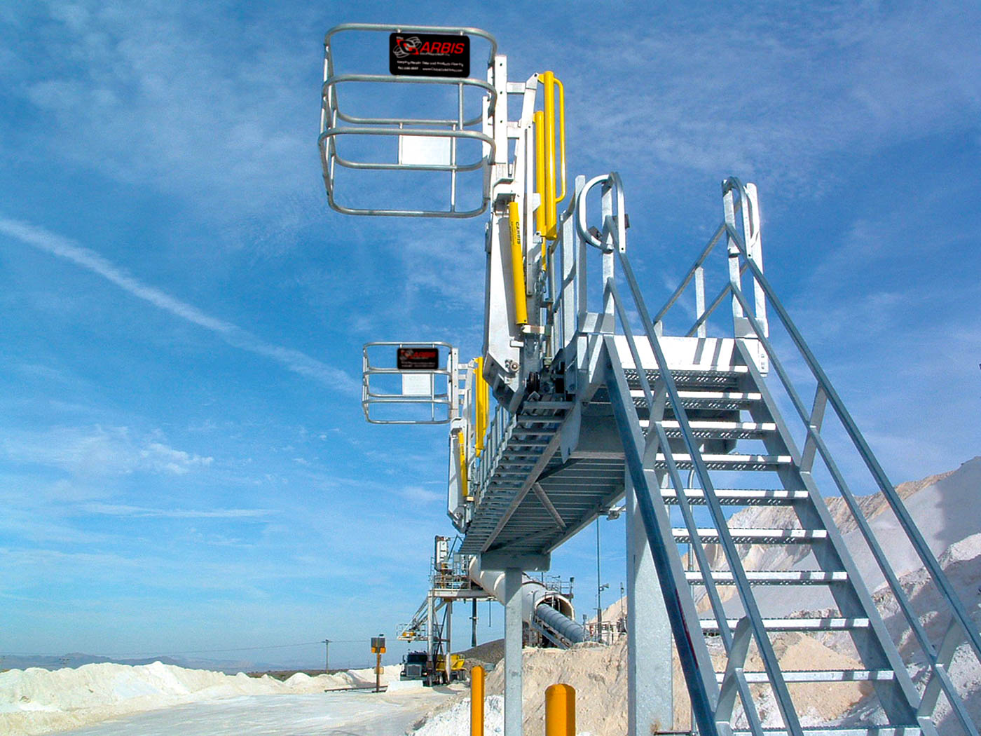 Carbis single hatch truck loading system above an area where cement is made.