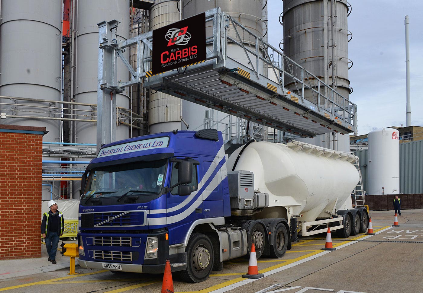A Carbis elevated tanker truck platform hoisted above a tanker truck.