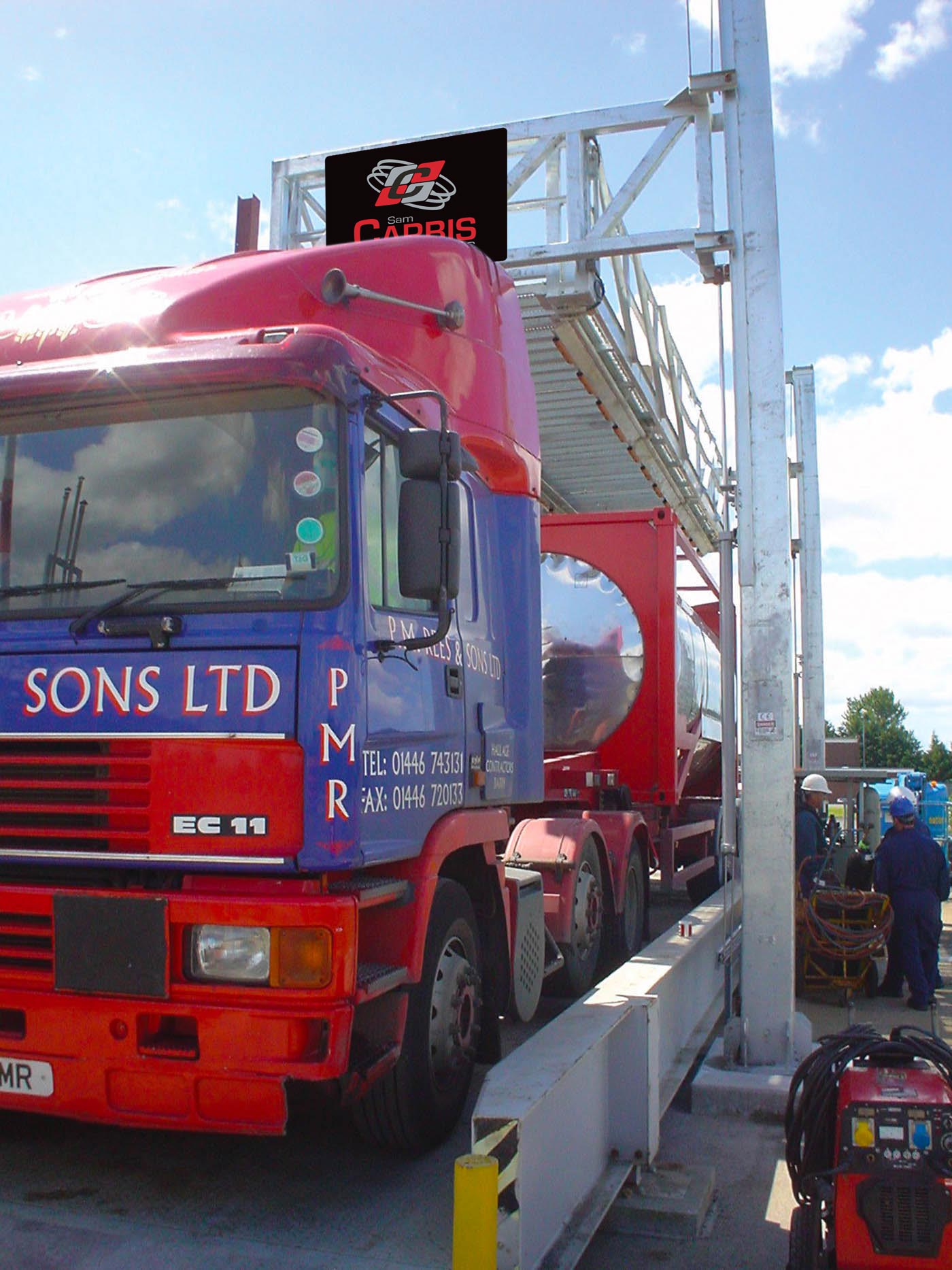 A Carbis elevated tanker truck platform hoisted above a tanker truck.