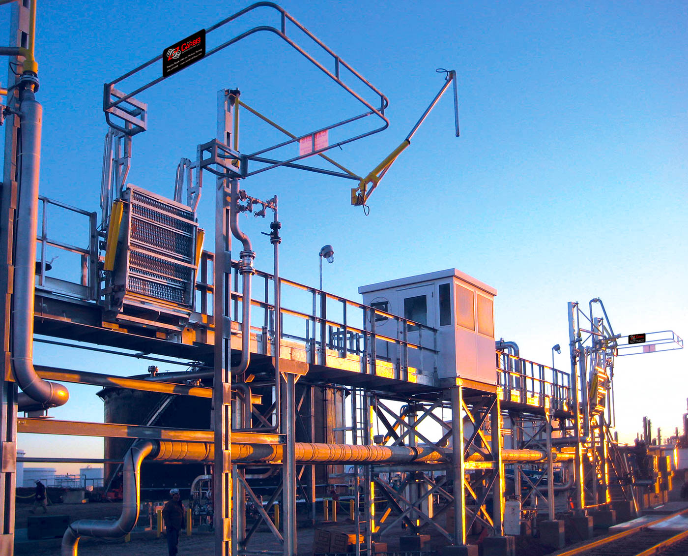 A railcar flat ramp with an operator box and a rail car loading system.