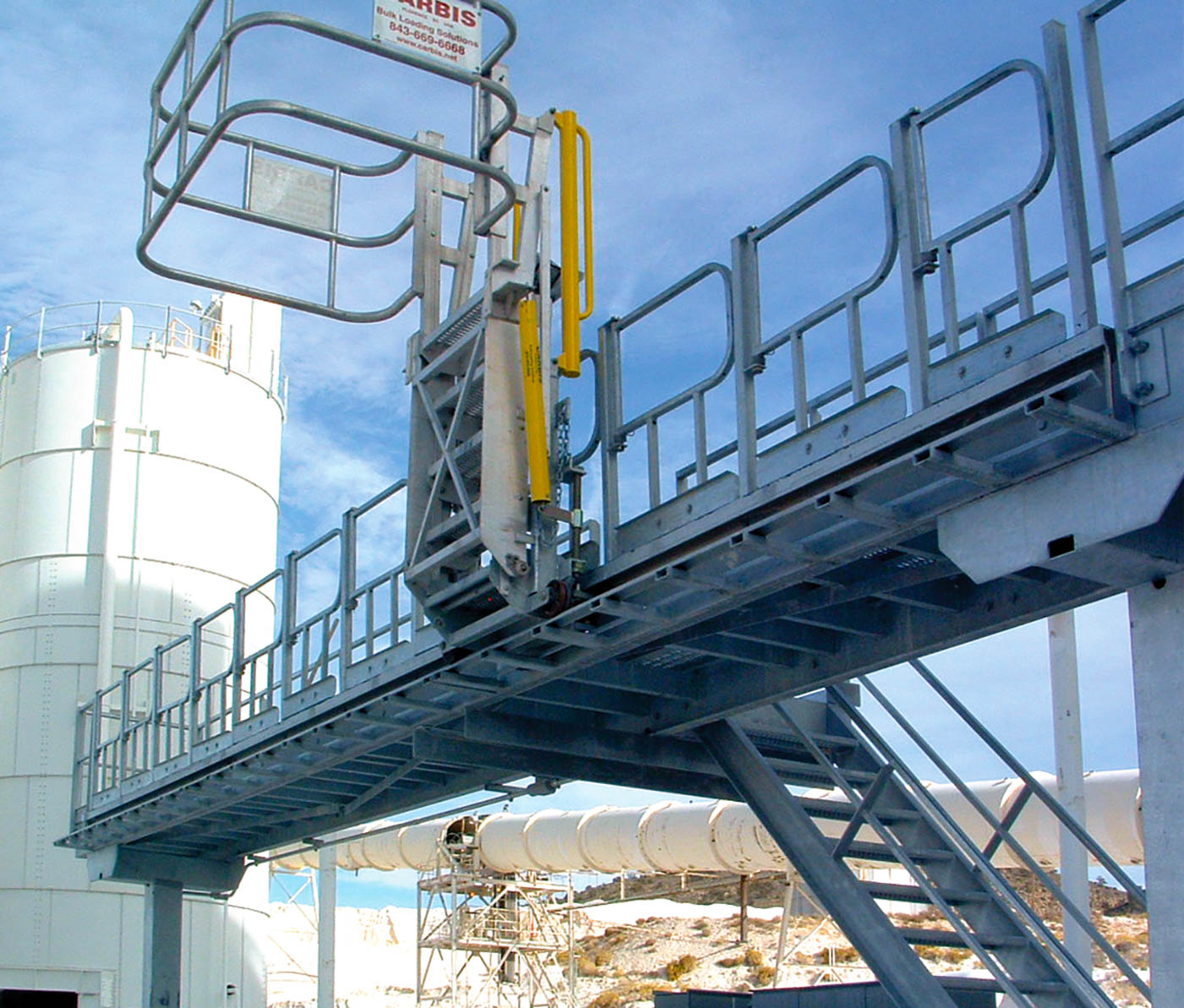 Swing gates on a loading platform in a refinery.