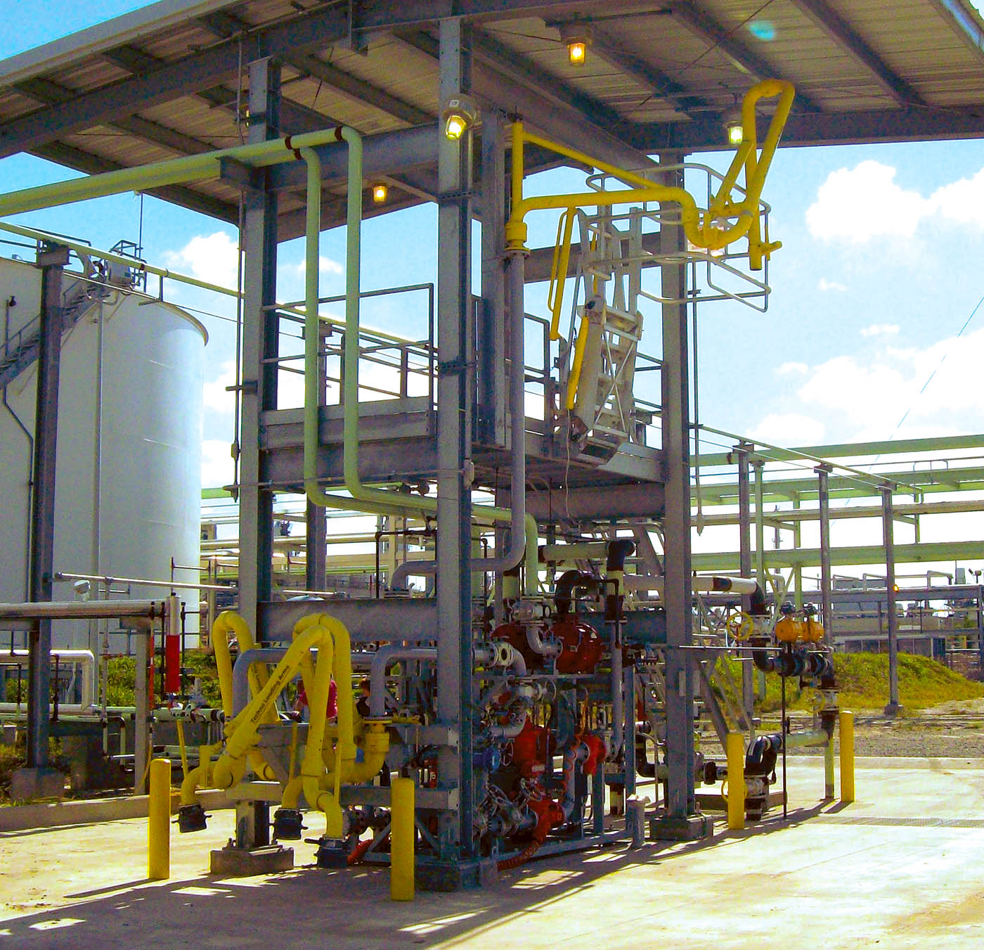 A loading bay with top loading arms and bottom loading arms.