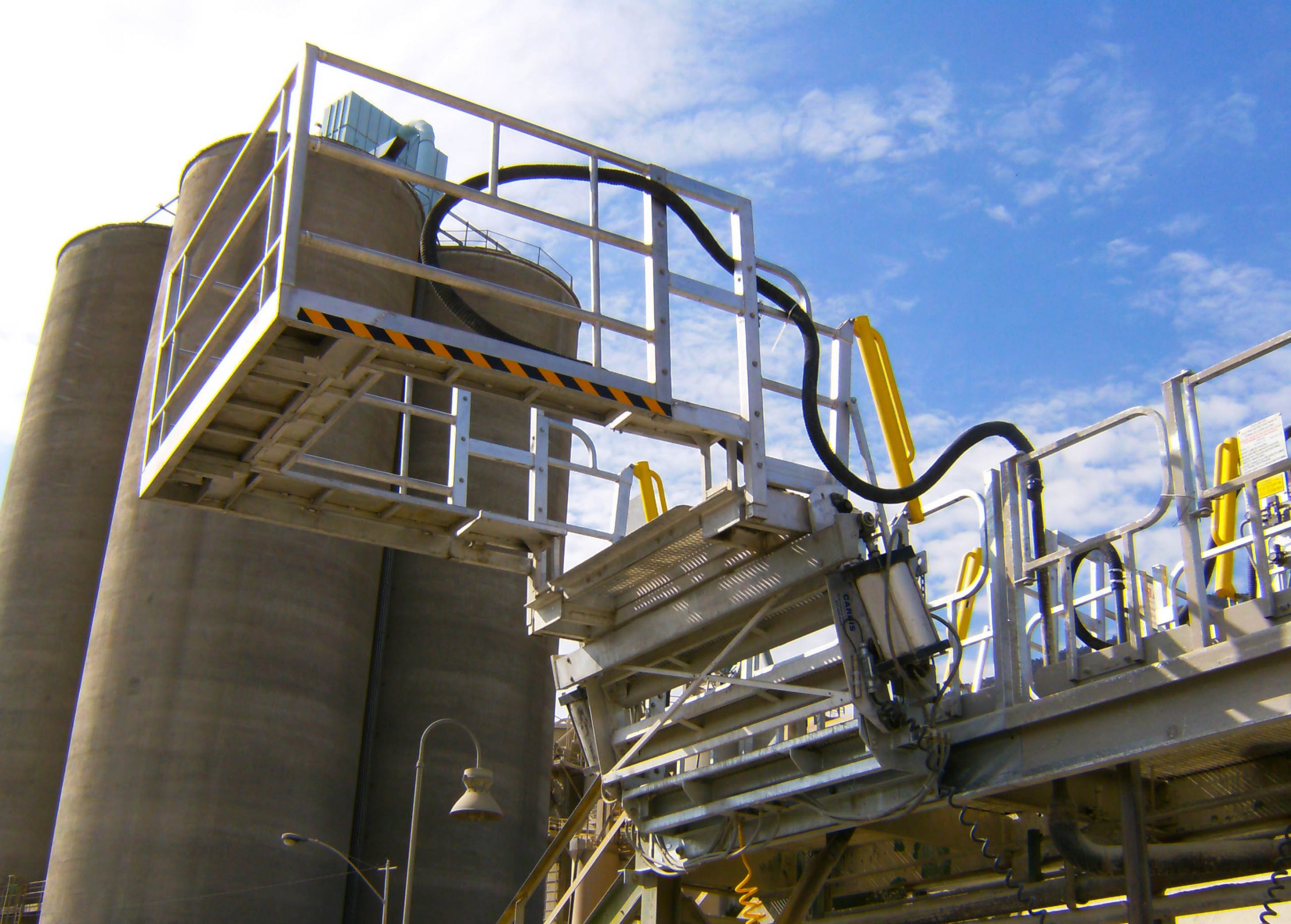 A custom safety cage stands high on a loading dock.