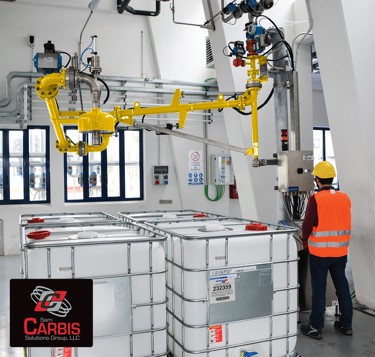 A top loading arm is flanged together with piping systems above chemical containers.