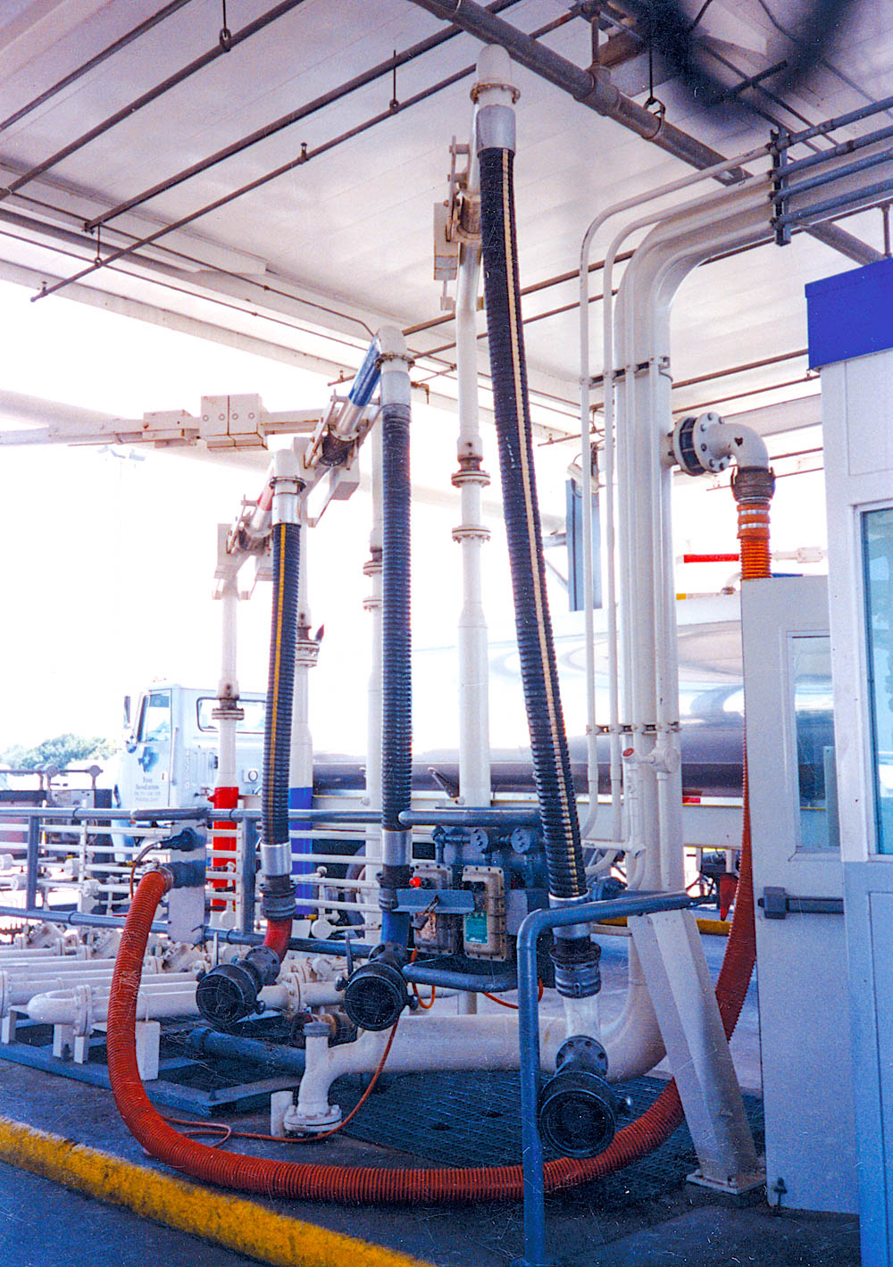 A loading bay with bottom loading systems and bottom loading arms.
