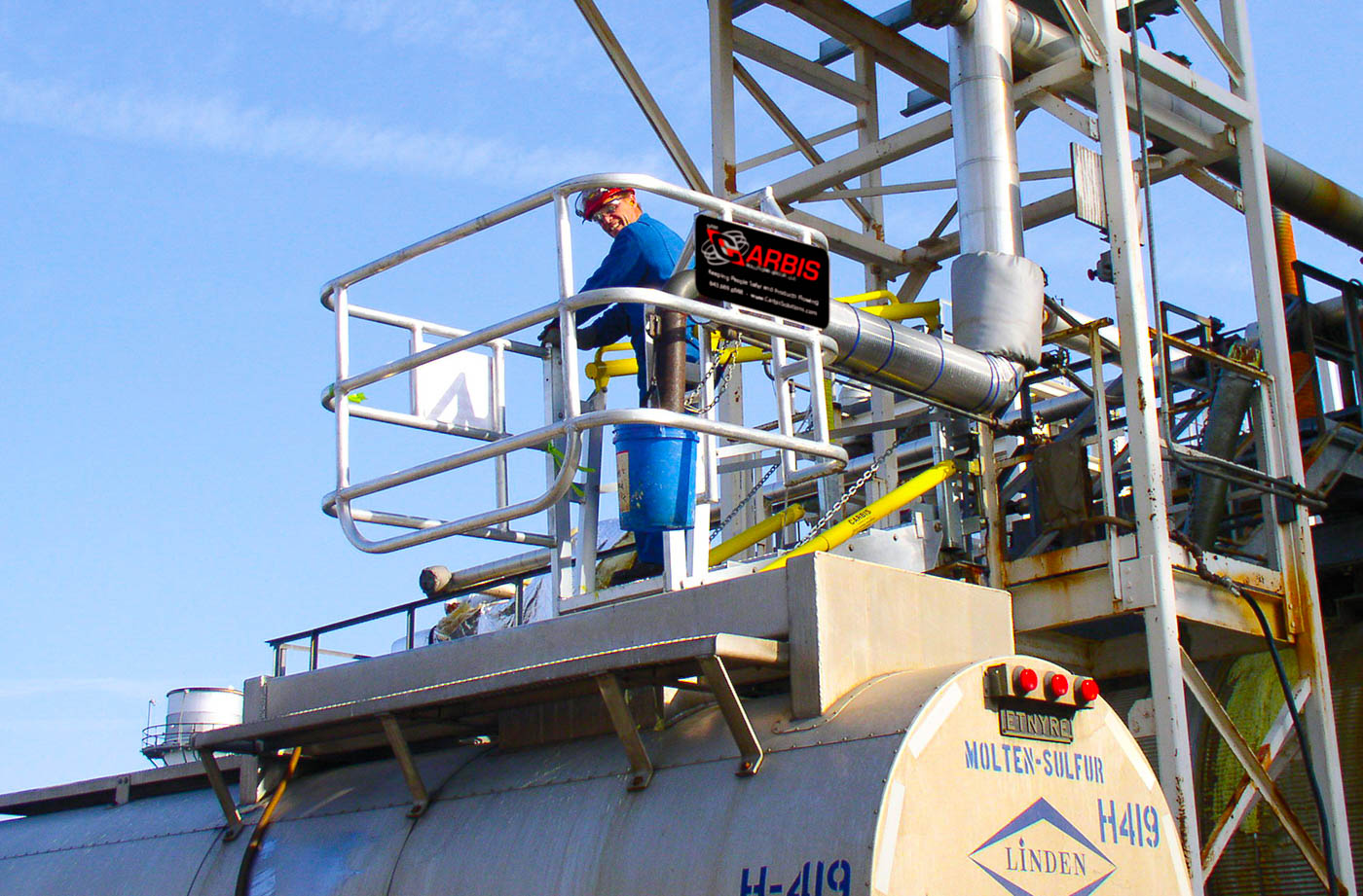 A man is in a truck safety cage of a Carbis Solutions gangway.