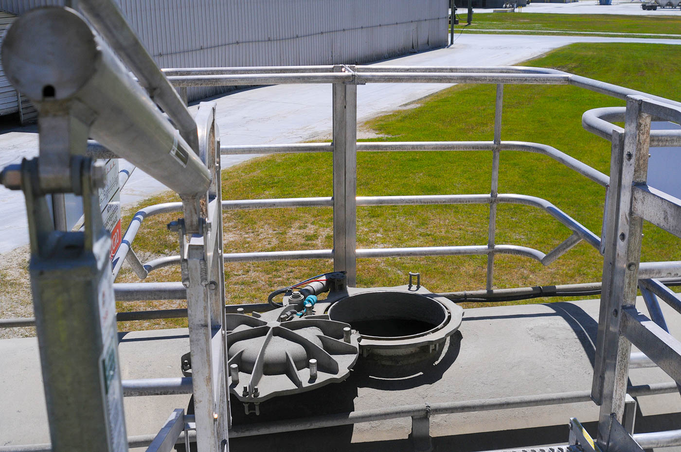 A truck safety cage sits atop a tanker truck.